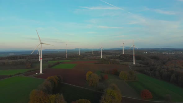 drone flight over wind turbine park in a rural landscape