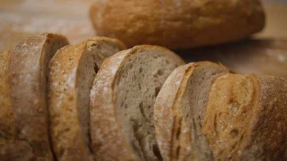 Rotating freshly baked sliced bread in bakeries
