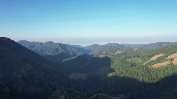 Aerial landscape view of greenery rainforest mountains by drone