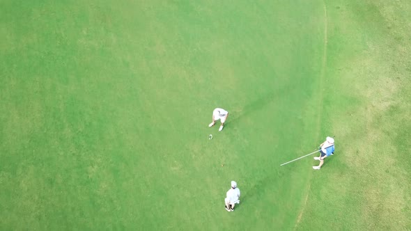 A couple of golfers making some bad putts.