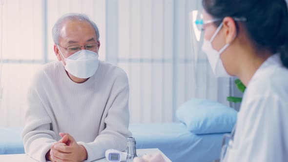 Asian senior man patient visit and consult health problem with doctor during appointment