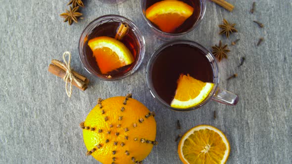 Glasses of Hot Mulled Wine with Orange and Spices
