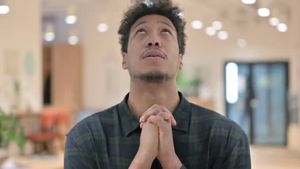 Hopeful African American Man Praying