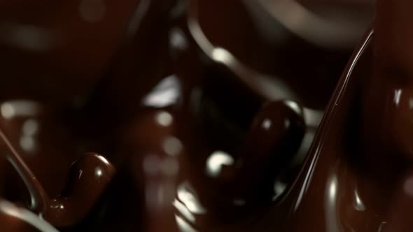 Super Slow Motion Detail Shot of Splashing Melted Chocolate at 1000 Fps