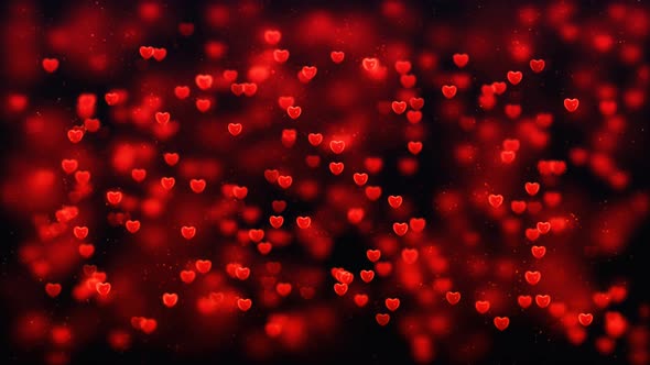 Abstract red hearts on dark background.