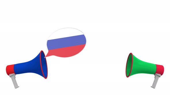 Flags of Italy and Russia on Speech Balloons From Megaphones