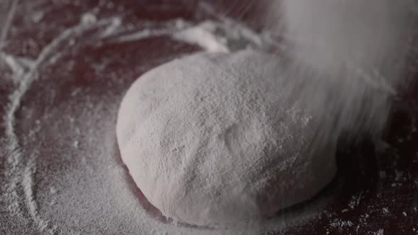 The Chef Sprinkles Flour Into A Round Shape Dough