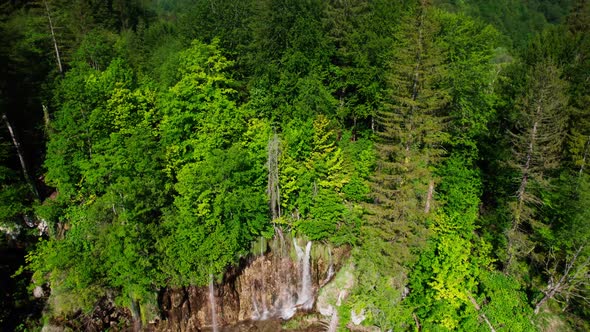 Plitvice lakes National Park Croatia, Europe, drone view of waterfall and vibrant colored lakes