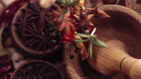 Wood Mortar and Spice Species Falling in Slow Motion