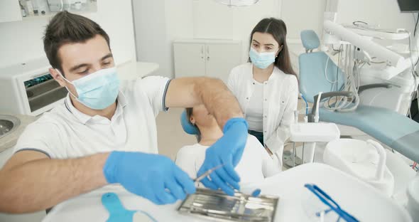 Male Dentist and Female Patient