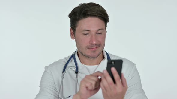 Smartphone Use By Male Doctor, White Background