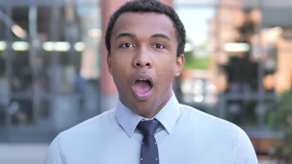 Shocked, Outdoor Wondering African Businessman