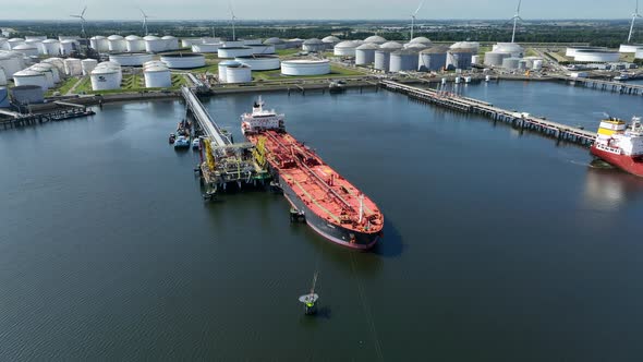 Liquid Cargo Transporter Ship Unloading Crude Oil to a Fuel Depot