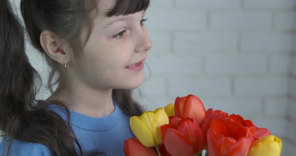 Child with anniversary flowers.