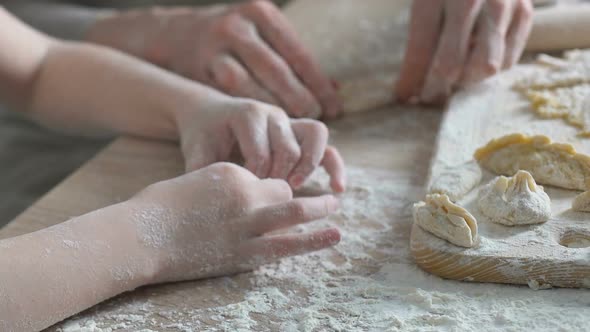 Sweet Little Girl Trying to Cook Pastry, Helping Her Granny in Kitchen, Family