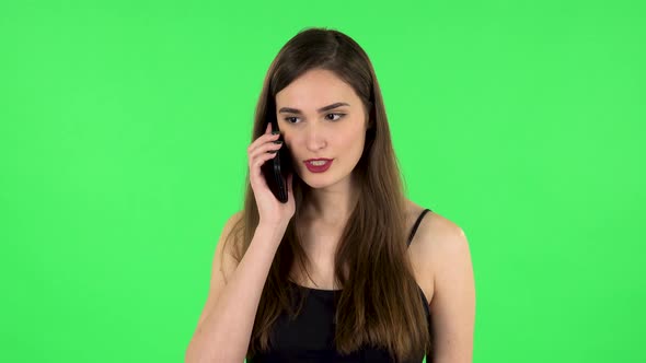 Girl Talking for Mobile Phone, Very Shocked. Green Screen