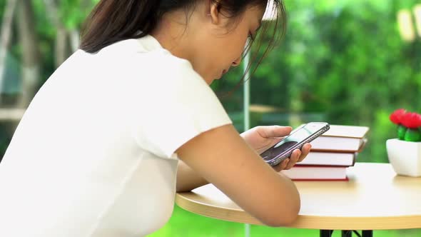 Young Teenager Spending Time With a Mobile Phone