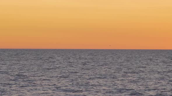 Beautiful view of the calm Baltic sea after the sunset in summer, medium shot from a distance