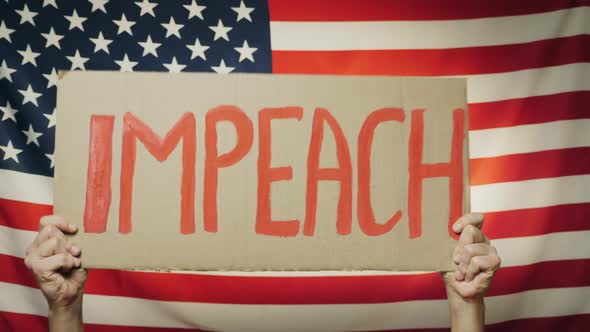 US President Impeachment Sign in Hands