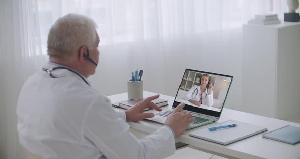 Young Medical Intern Woman Is Calling To Her Teacher To Consulting By Video Conference, Experienced