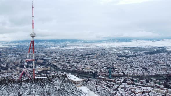 Snowy Transmit Mast Over The City