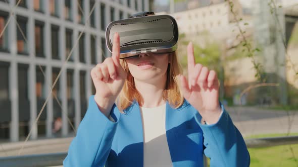 Business Woman Wearing Professional Virtual Reality Headset and Gestures in Augmented Reality