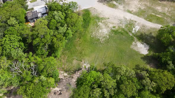 Aerial track through a razed area that use to be Bluffton School in Muskegon.