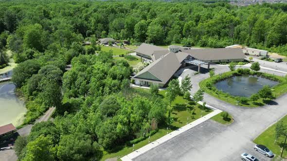 Aerial over Heartland Forest main building entrance in Niagara Falls, ON, Canada