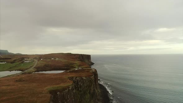 Aerial of the Cliffs and Bay Near Neist Point Skye on a Cloudy Day