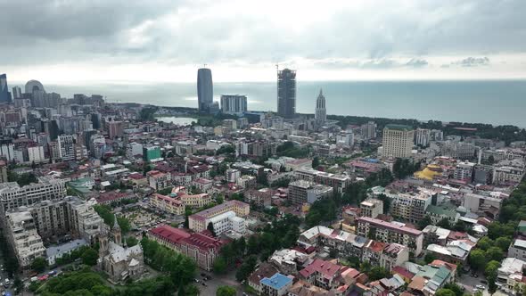 Aerial view of beautiful lake in the center of Batumi. flying over 6 May park. Georgia 2022 summer