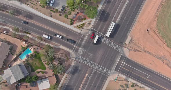 Aerial view of cars driving on highway intersection with junction road