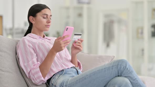 Successful Online Payment on Smartphone By Latin Woman at Home