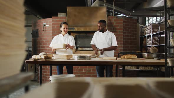 Animation of diverse male and female bakers preparing sourdough for bread