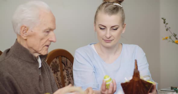 Woman Giving Easter Basket To Grandfather