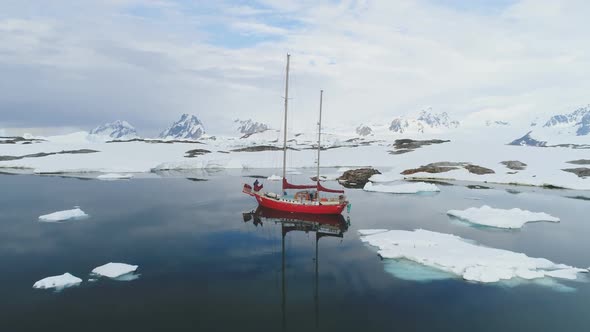 Sailboat Travel in Antarctica Iceberg Ocean Aerial