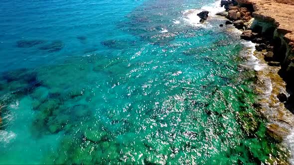 Crystal clear turquoise blue water at sea caves Ayia Napa Cyprus view