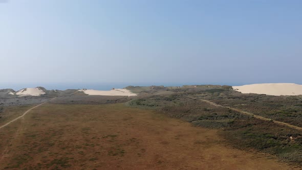 Aerial view of dunes by the North Sea shoreline at Rubjerg Knude, Løkken, Denmark