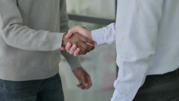 Slow Motion of Mixed Race Businessmen Shaking Hands