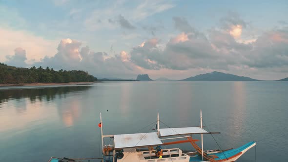 Lonely Sailboat at Tranquil Sunrise Aerial Closeup Shot