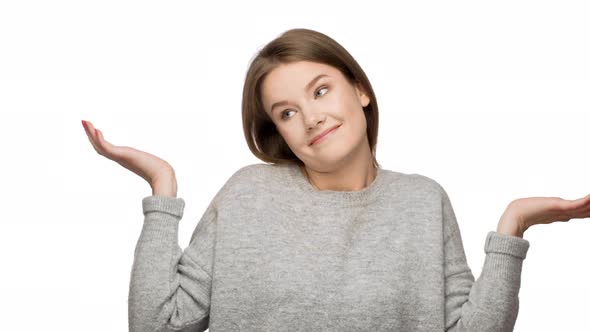 Horizontal Portrait of Brunette Woman Gesturing with Both Hands Meaning Oops Sorry Pretending Has No