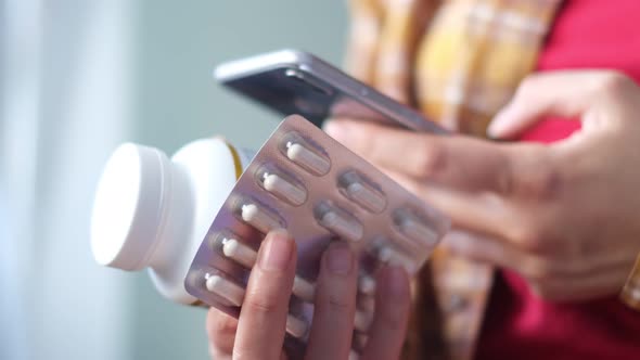 Unrecognizable Woman Reading Online Medication Instructions