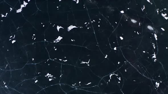 Drone Shot Of Cracked Ice Of Frozen Lake