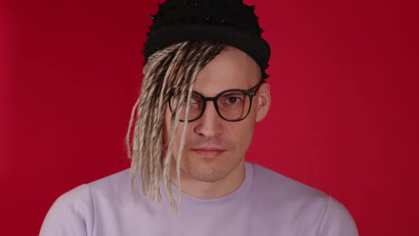 Young Handsome Man in Black Cap Glasses Nodding Head with Approval