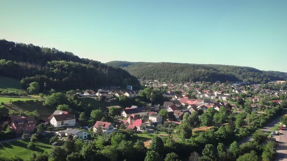 Mountain village surrounded by mountain green hills