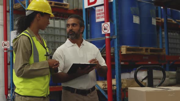 Workers interacting in a warehouse