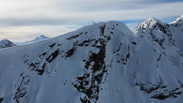 Aerial View of Cheget Mountain Range in Snow in Winter in Sunny Clear Weather