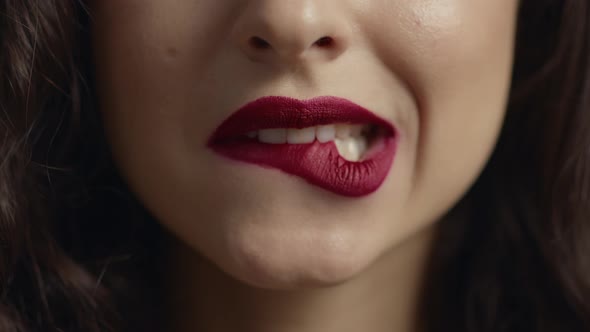 Sensual Girl Biting Sexy Plump Lips