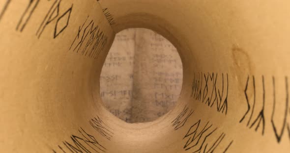 Ancient scribe library. Futhpak scrolls stacked on a pile.