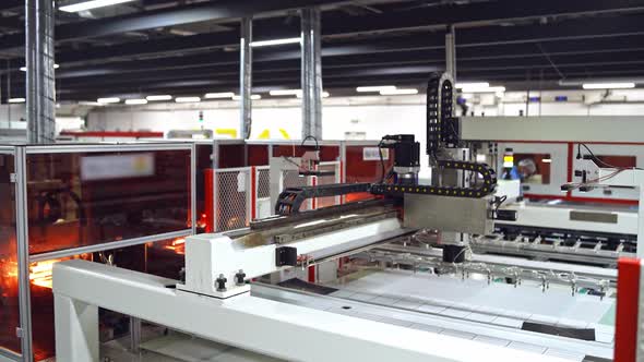 Smart factory industry. Robotic machine tool in industrial manufacture of solar panels