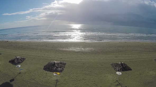 Cool Aerial View Above Straw Parasols Standing on Beach in Larnaca, Cyprus